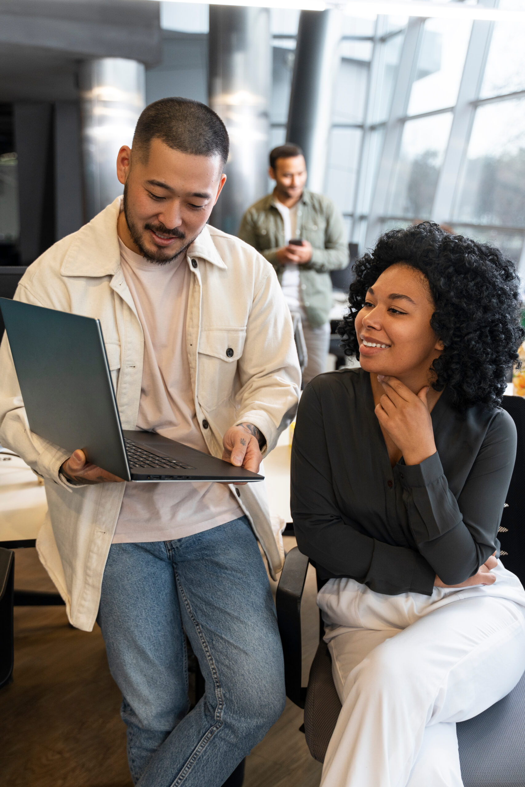 Two business professionals looking at laptop